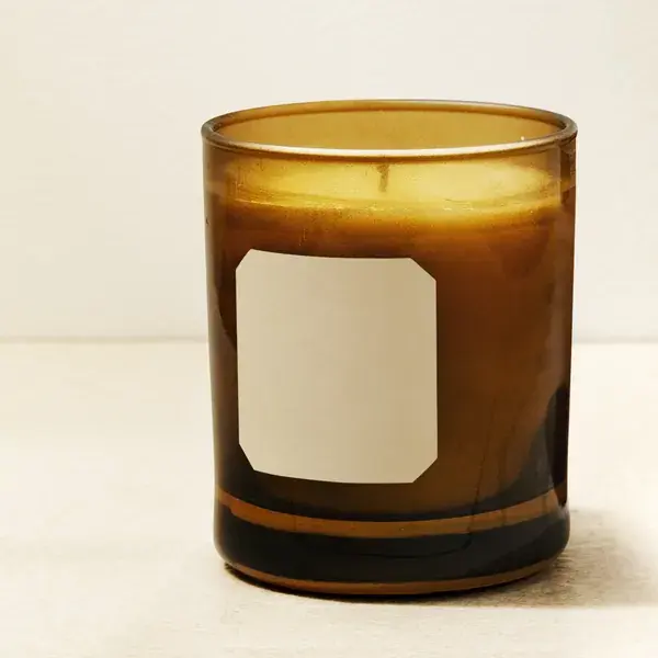 Hand-poured soy candle in an amber glass jar