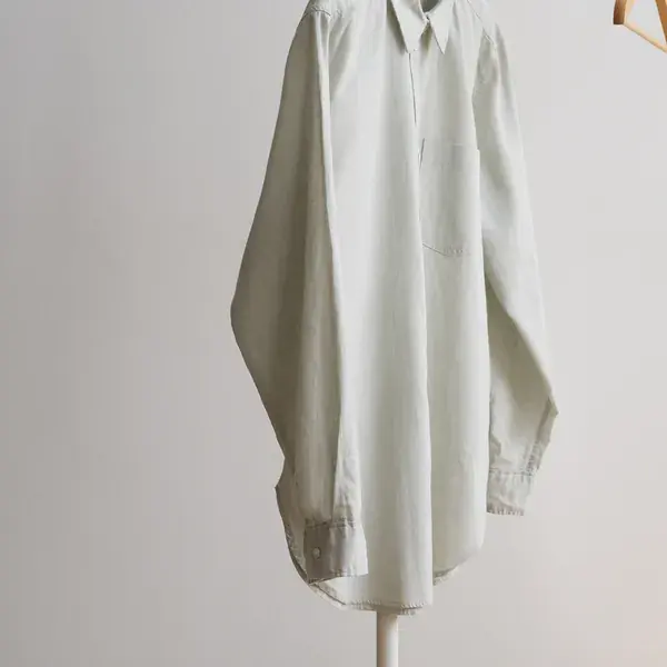 Featured image: relaxed white linen shirt hanging on a rail